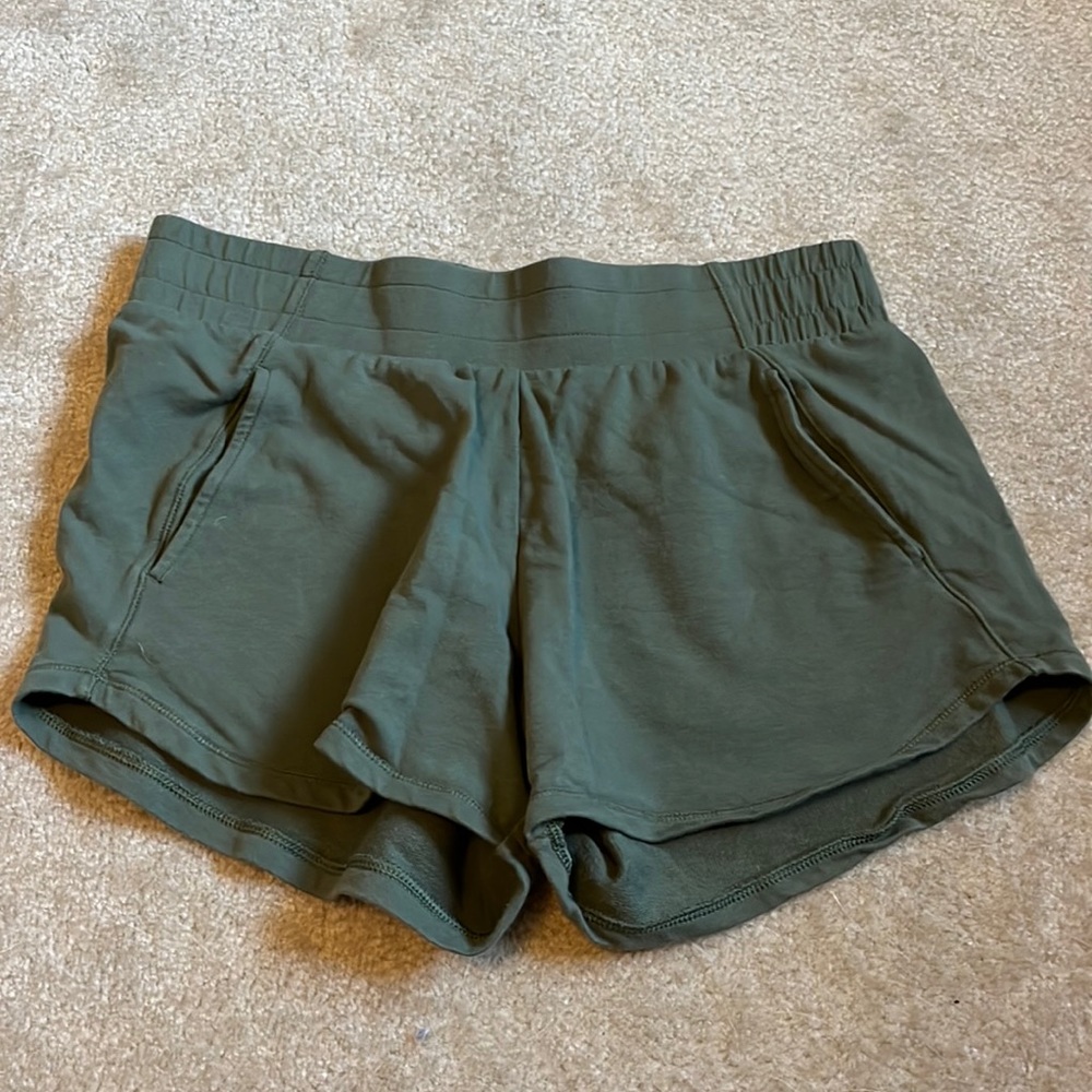 green sweat shorts